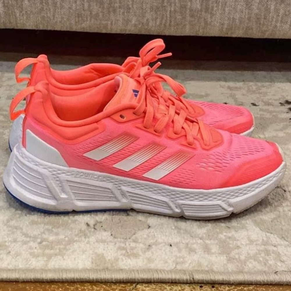 Adidas tennis shoes. Bright colors, made for running. Used but new.